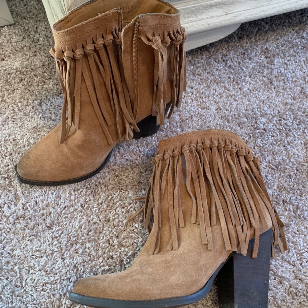 Very volatile fringe booties